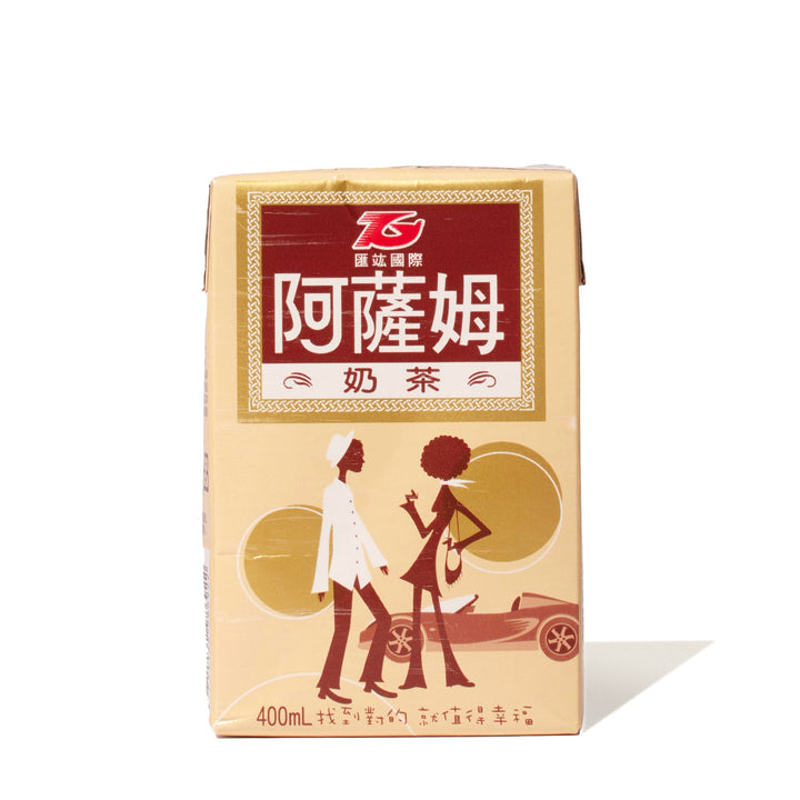 A box of T. Grand Assam Milk Tea (6-pack) with a woman on it.
