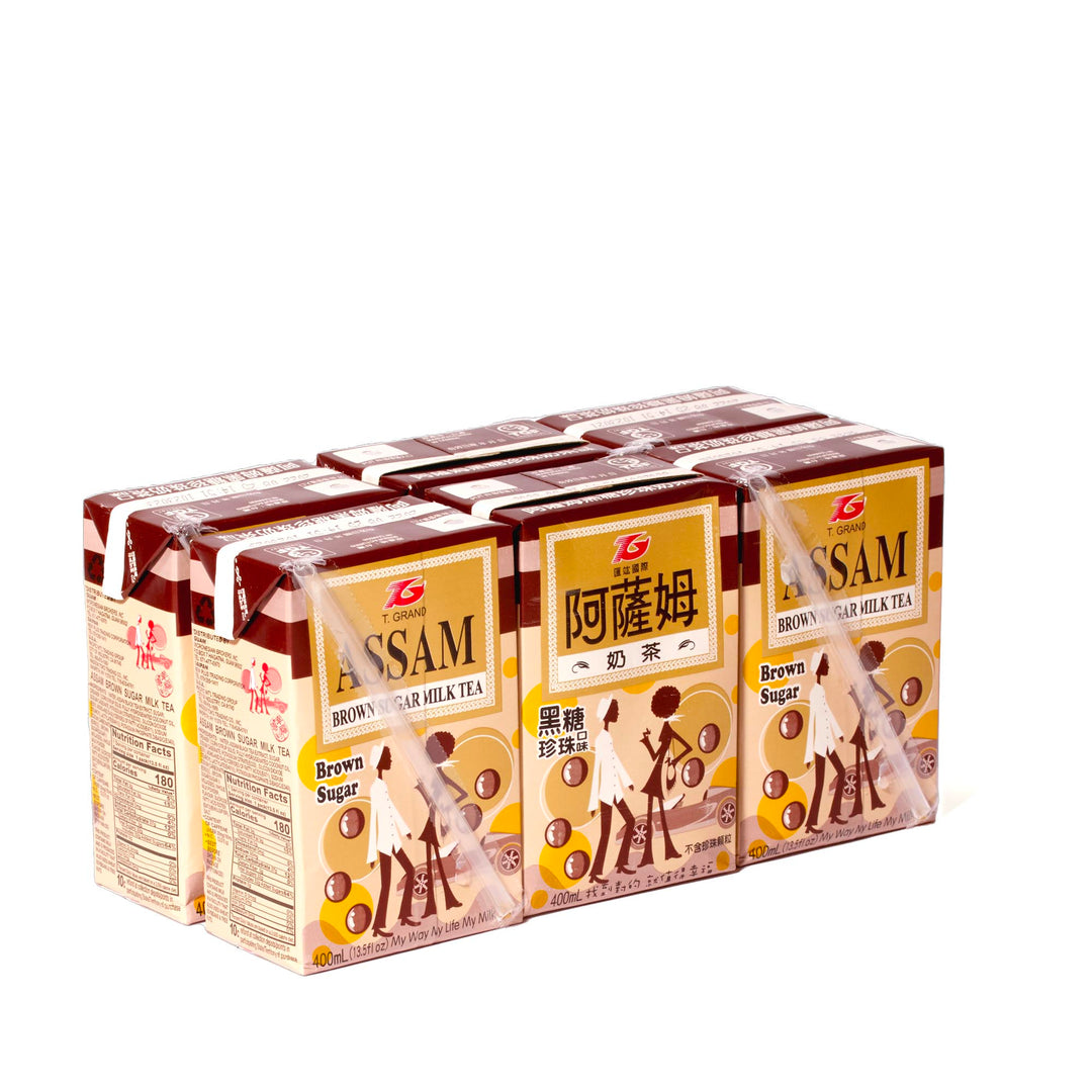 A box of T. Grand Assam Black Sugar Milk Tea (6-pack) is sitting on top of a white background.