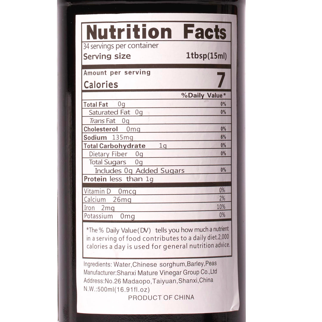 A bottle of Eastlake Donghu Shanxi Superior Mature Black Vinegar nutrition facts on a white background.