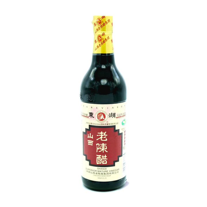 A bottle of Eastlake Donghu Shanxi Superior Mature Black Vinegar on a white background.