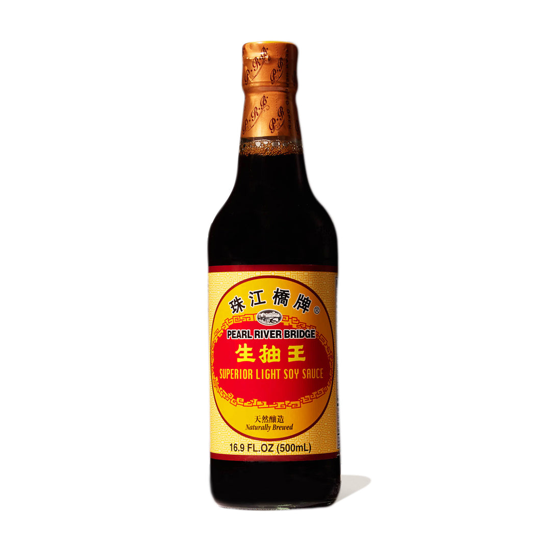 A bottle of Pearl River Bridge Superior Sheng Chou Light Soy Sauce on a white background.