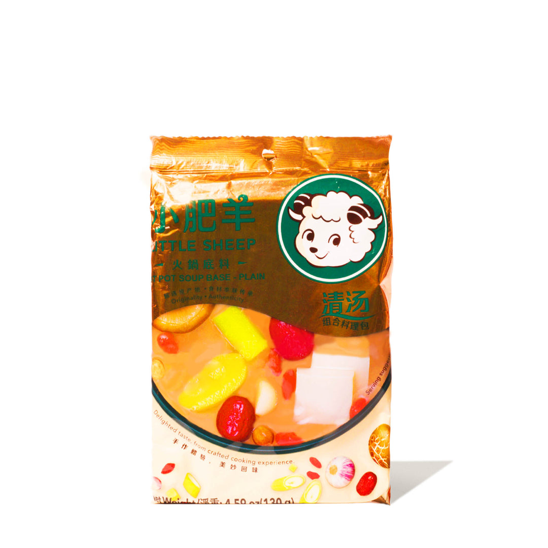 A bag of Little Sheep Hot Pot Soup Base: Plain with a picture of a sheep on it.