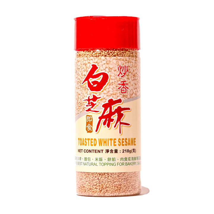 A jar of JL Toasted White Sesame Seeds on a white background.