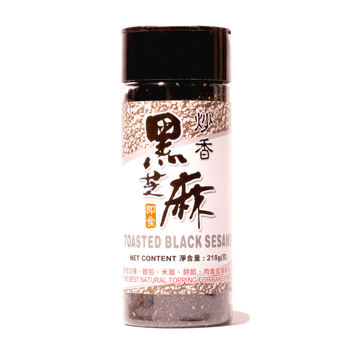 A bottle of JL Toasted Black Sesame Seeds on a white background.