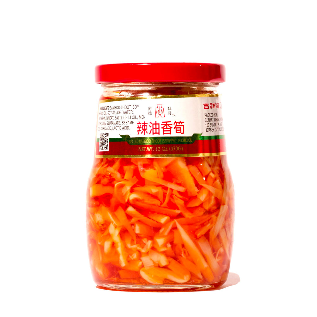 A jar of Oriental Mascot Pickled Bamboo Shoot in Chili Oil on a white background.