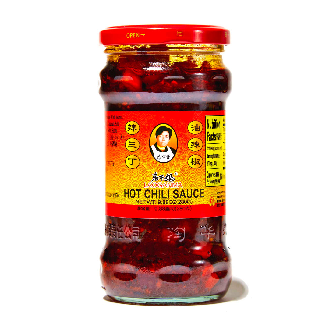 A jar of Lao Gan Ma Crunchy Hot Chili Sauce on a white background.