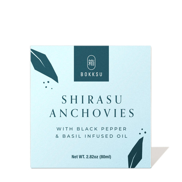 Bokksu Tinned Shirasu Anchovies with Black Pepper and Basil-Infused Oil.