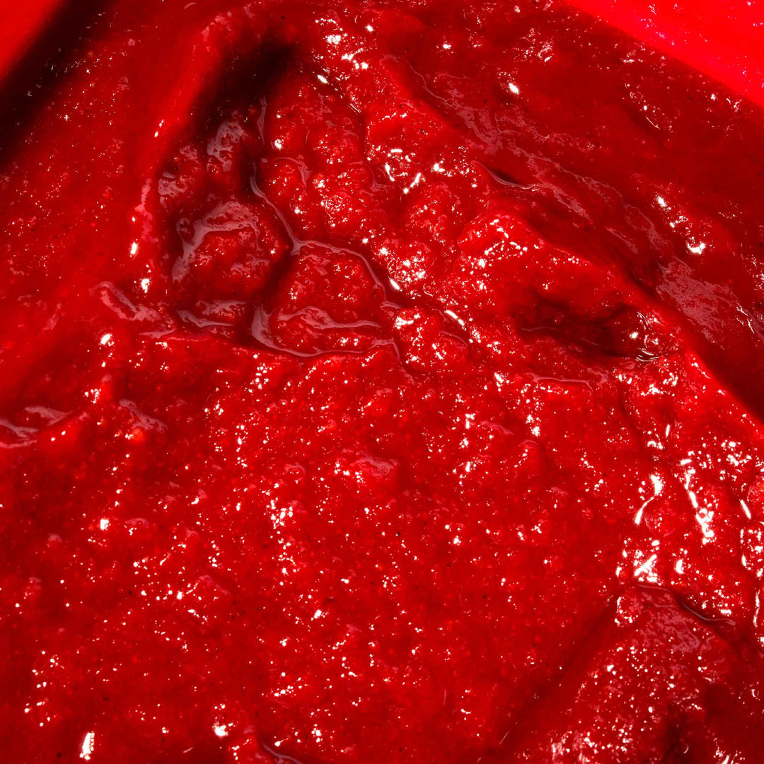 A close up of Jonggavision Gochujang Hot Pepper Paste, a red liquid.