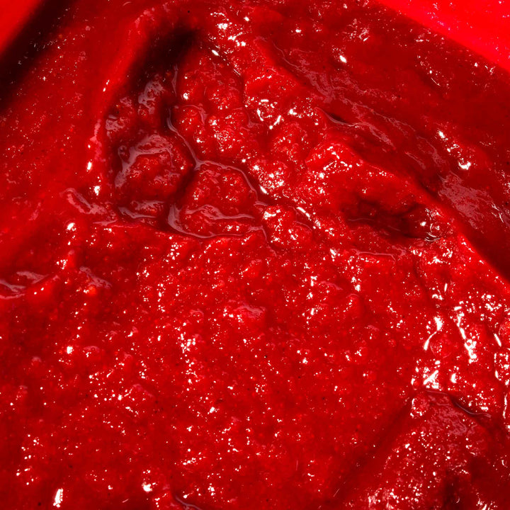 A close up of Jonggavision Gochujang Hot Pepper Paste, a red liquid.