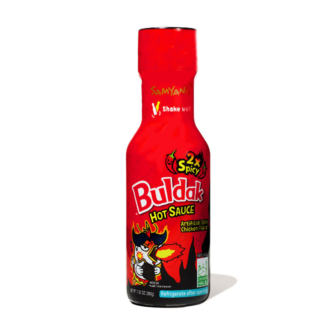 A bottle of Samyang Buldak Sauce: Extreme Spicy Chicken on a white background.