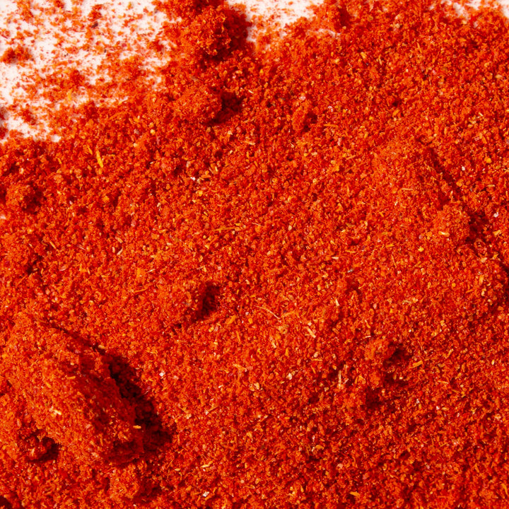 Assi Gochugaru Red Pepper Flakes on a white background.