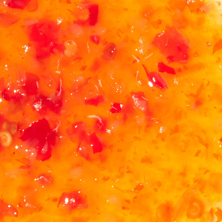 A close up of Mae Ploy Sweet Chili Sauce.