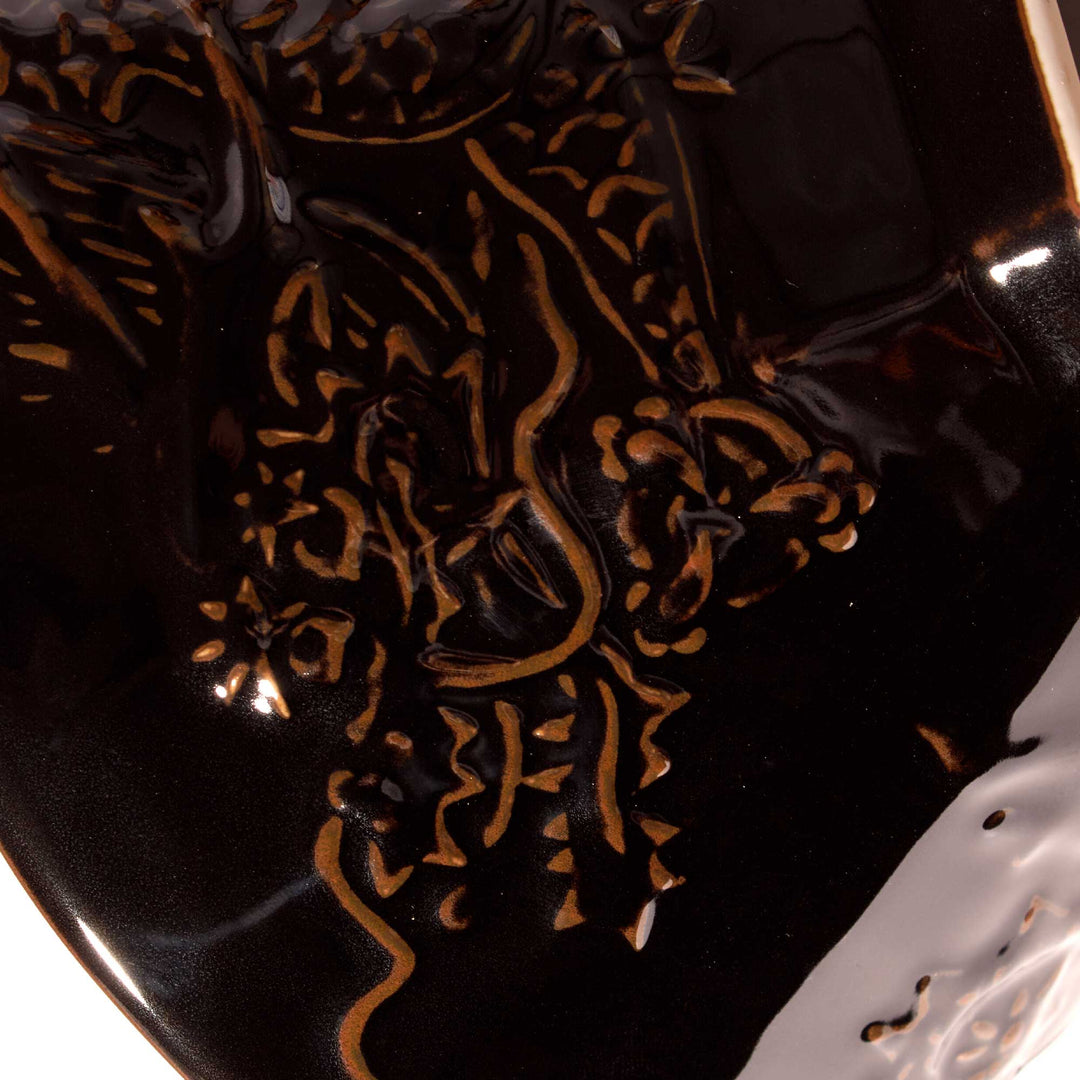 A Black Tenmoku Round Ramen Bowl with a dragon on it from the brand Korin.