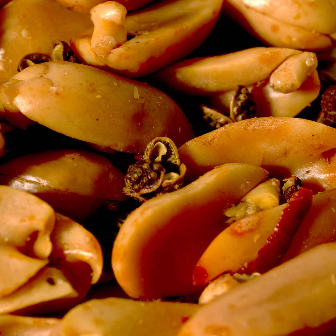 A close up of a bowl of Huang Fei Hong Sichuan Pepper Peanuts: 3.9 oz.