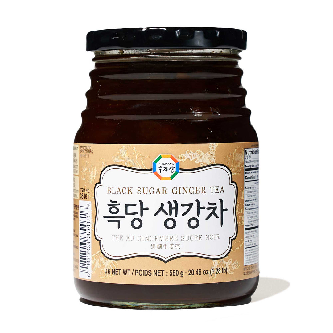 A jar of Surasang Premium Black Sugar Ginger Tea on a white background.