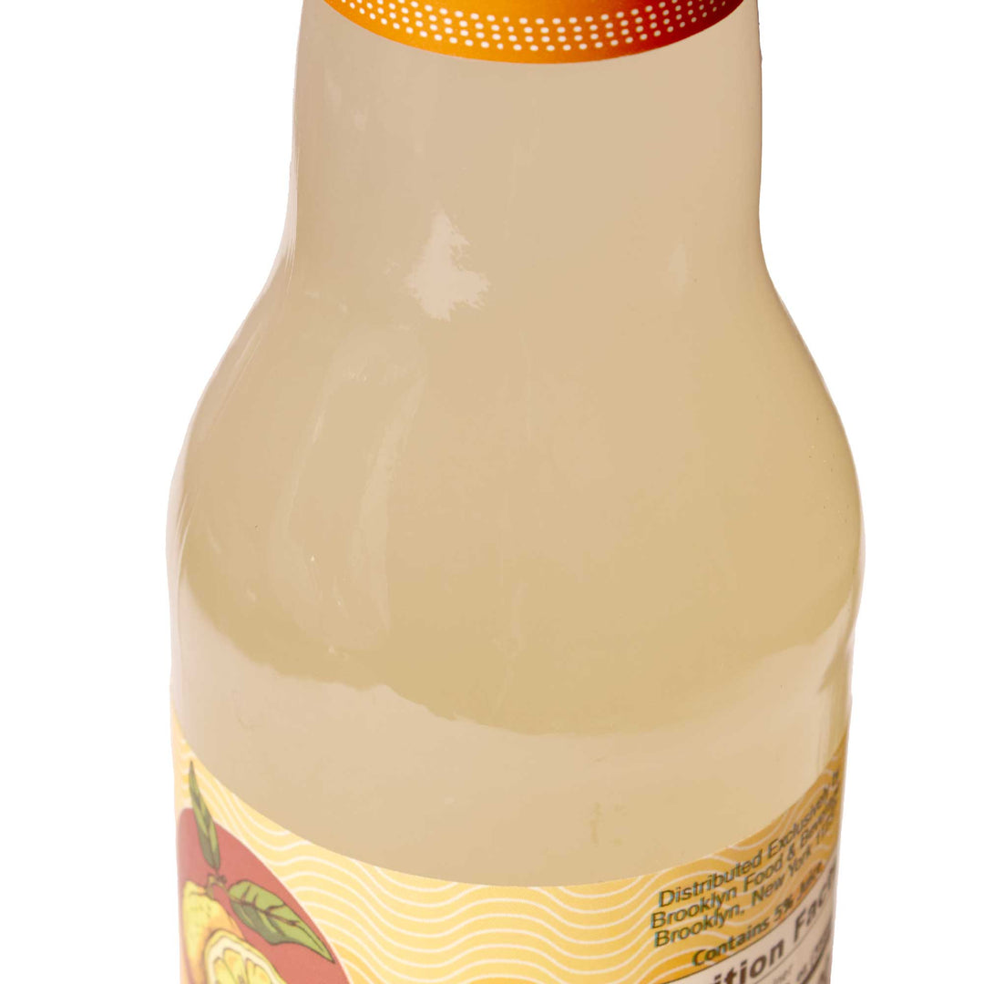 A bottle of Moshi Sparkling Juice Drink: Original Yuzu on a white background.