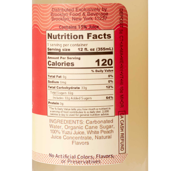 A label showing the nutrition facts of a bottle of Moshi Sparkling Juice Drink: Yuzu & White Peach.
