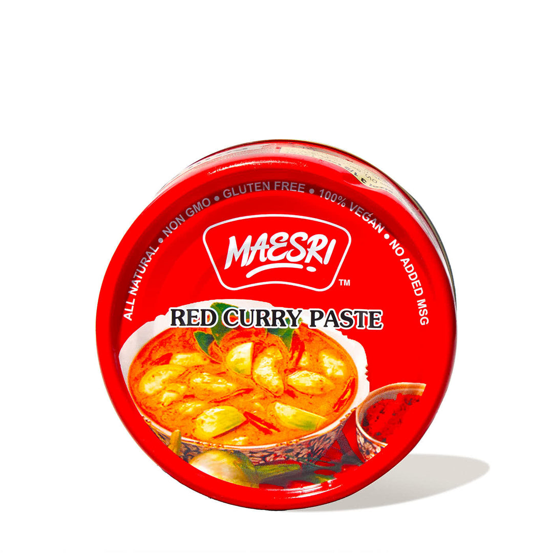 A tin of Maesri Thai Red Curry Paste on a white background.