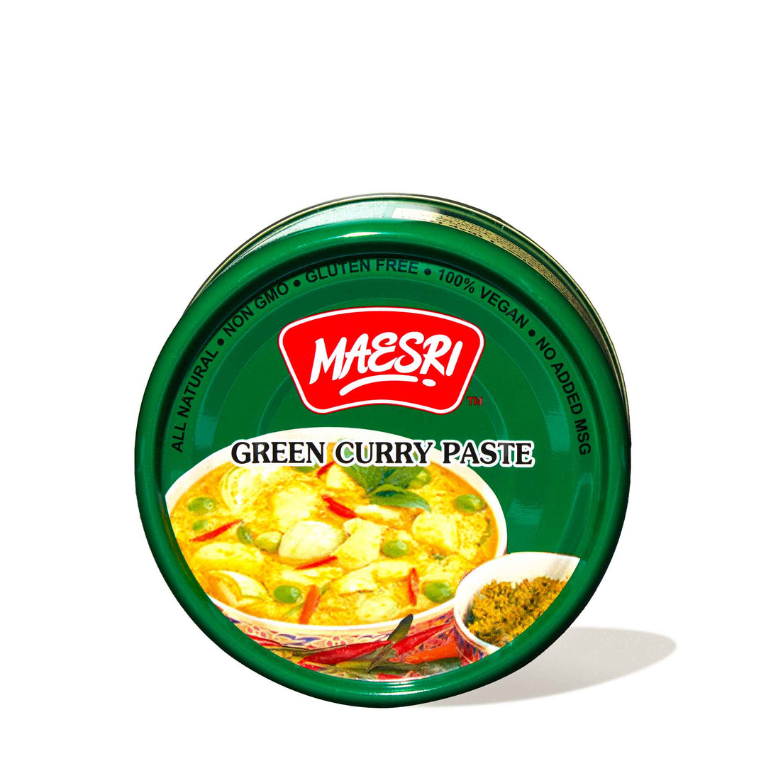 A tin of Maesri Thai Green Curry Paste on a white background.