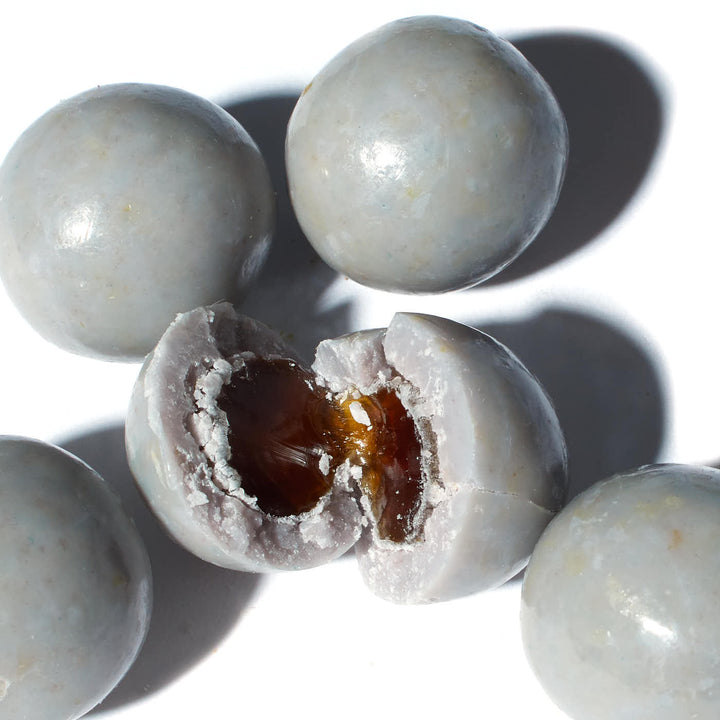 A group of Toko Boba Chocolates: Taro Milk Tea with a hole in the middle.