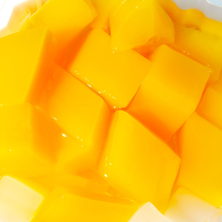 A bowl of IA Foods Mango Pudding.