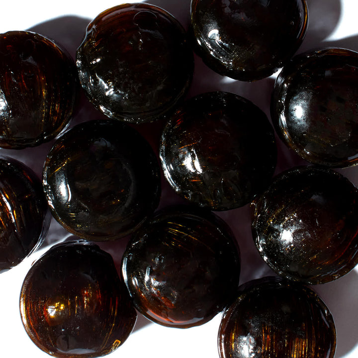 A pile of Ohkura Kumamon Candy: Kokuto Brown Sugar balls on a white surface.