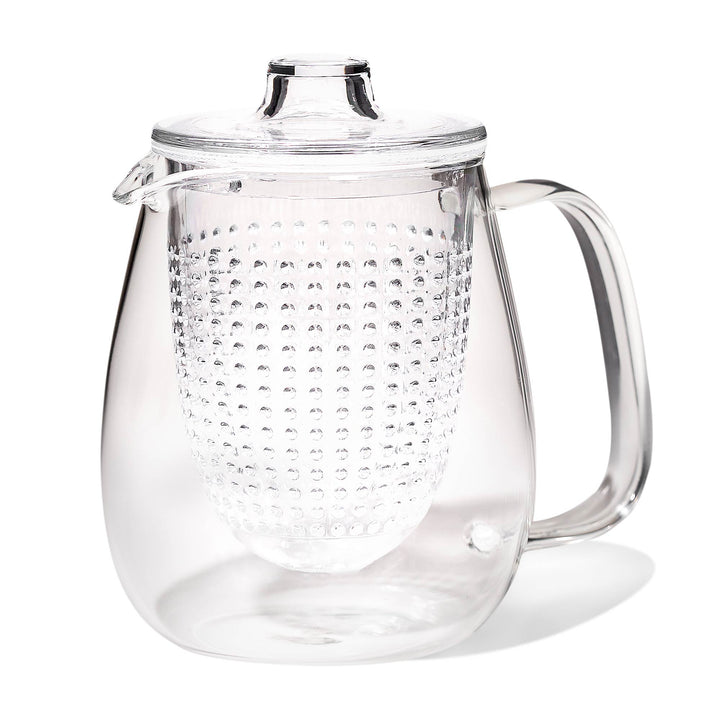 A Kinto Unitea Teapot with Glass Strainer with a lid on it.