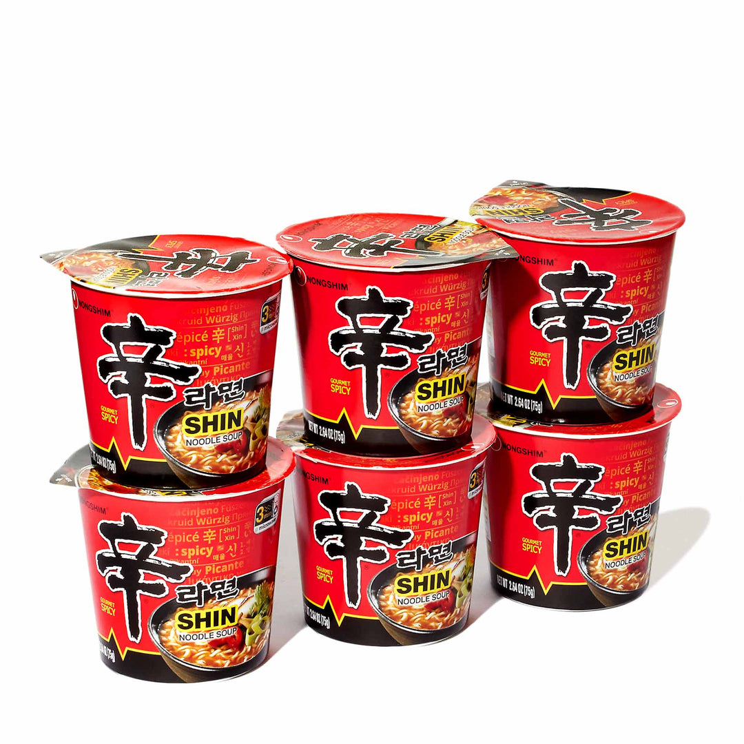 Six cups of Nongshim Shin Ramyun Spicy Ramen Cup (6-pack) on a white background.