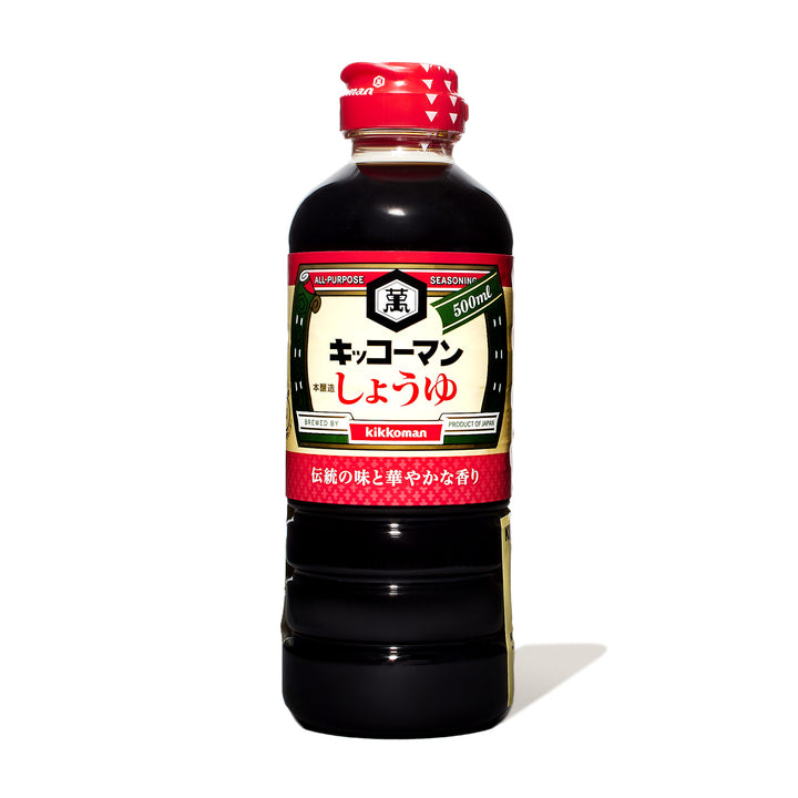 A bottle of Kikkoman Soy Sauce From Japan on a white background.