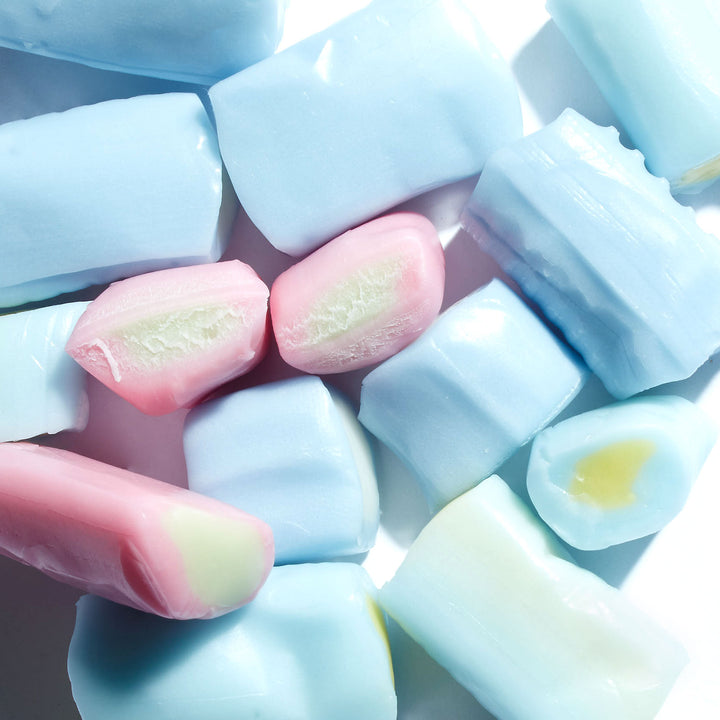 A pile of Morinaga Hi-Chew: Fantasy Mix marshmallows on a white surface.
