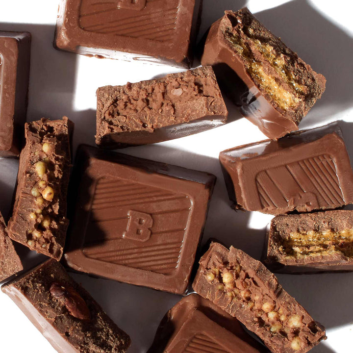 A group of Bourbon Mini Bit Chocolate: Assorted Mix bars with nuts and nuts.