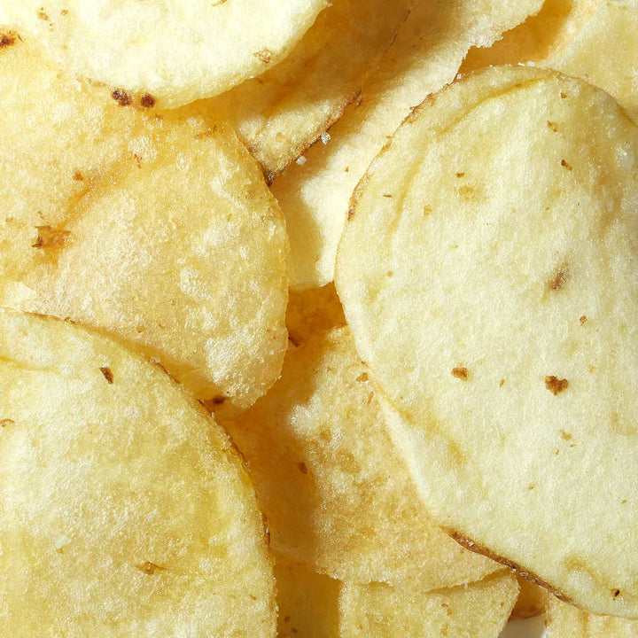 A pile of Koikeya Thick-Cut Potato Chips: Rock Salt on a white surface.