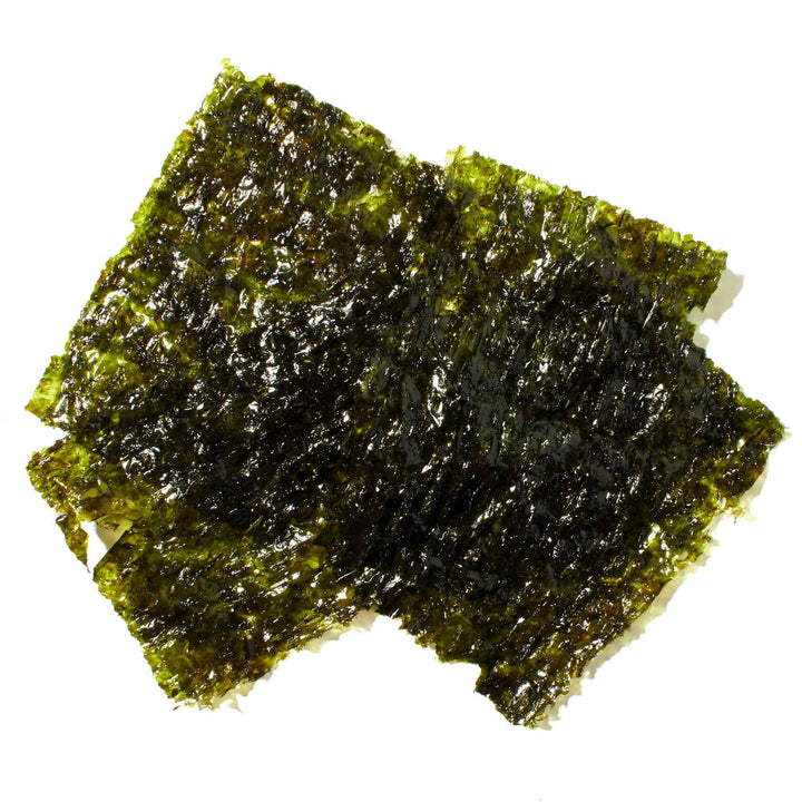A piece of Assi Roasted & Seasoned Seaweed Snack (10-pack) on a white background.