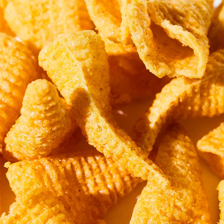 A close up of a pile of House Tongari Corn Crackers: Lightly Salted.