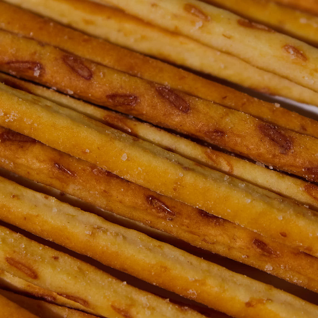 A close up of a bunch of Glico Pretz: Sweet Corn sticks.