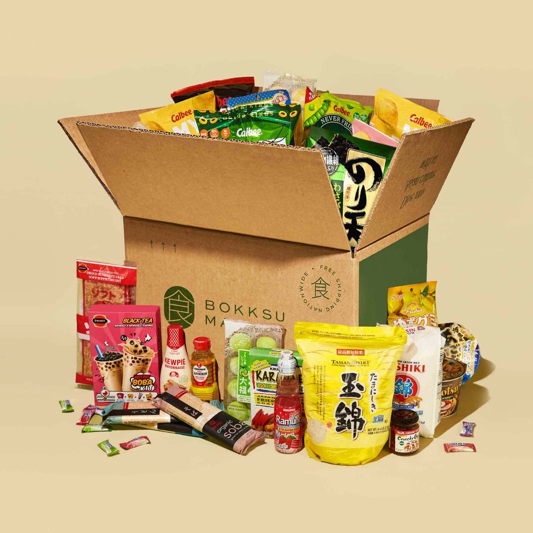 A box filled with a variety of Bokksu Market Discovery Packs.