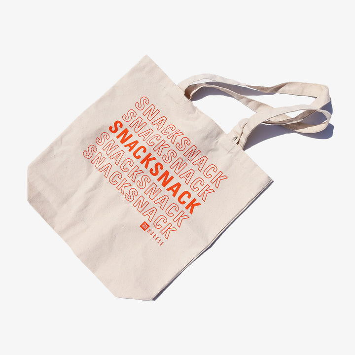 A Bokksu Snack Tote Bag with the word swacksnack on it.