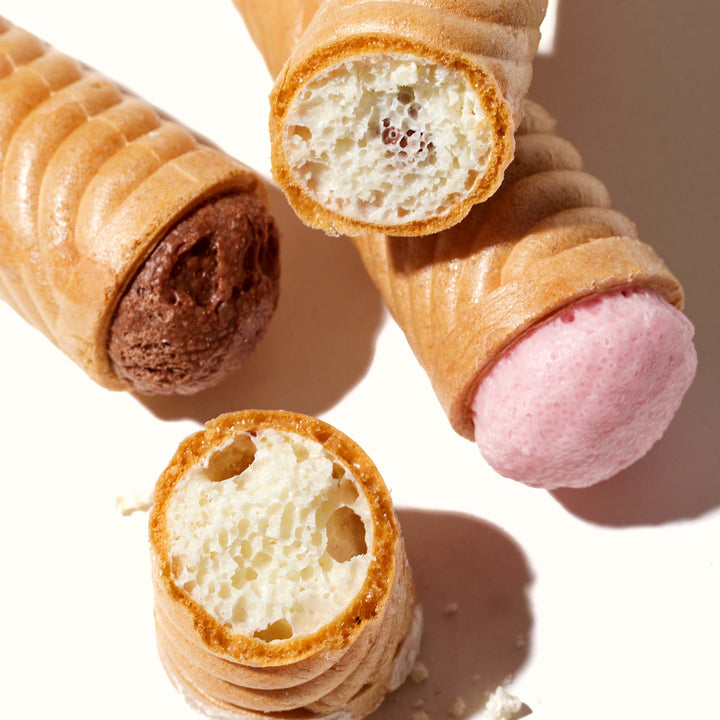A group of Glico Caplico Mini ice cream cones on a white surface.