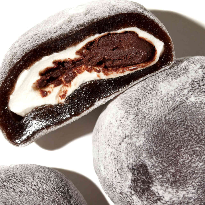 A Kubota Daifuku Mochi: Chocolate with cream filling and a hole in the middle.