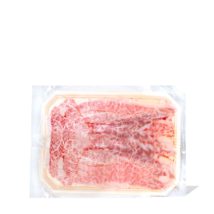 A frozen A5 Wagyu Sushi Slice Rib Cap (10 slices) from Wagyuman in a plastic container on a white background.