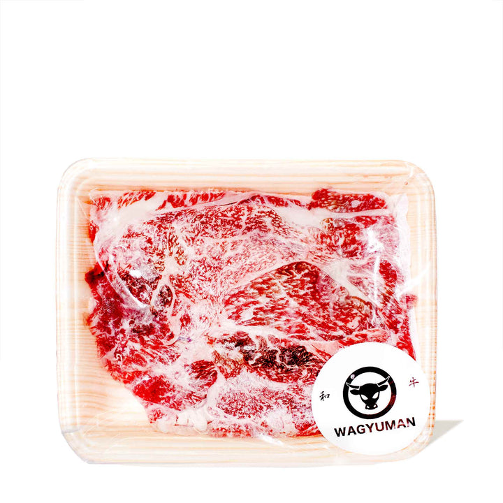 A5 Wagyu Beef Shaved Chuck Roll: Shabu Shabu (0.5 lb) by Wagyuman in a plastic container on a white background.
