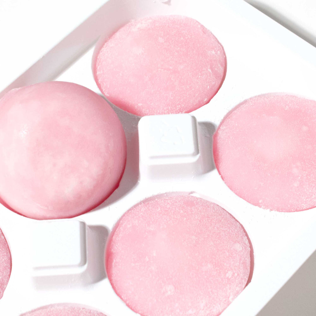 A tray of Maeda-en Mochi Ice Cream: Strawberry ice cubes sitting on top of a white surface.