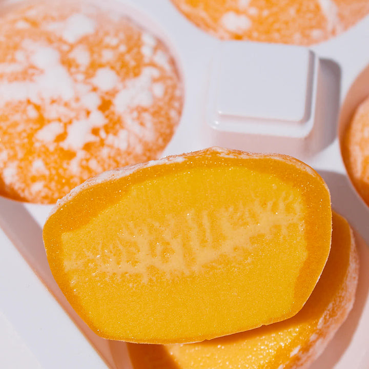 A tray of Maeda-en Mochi Ice Cream: Juicy Mango in a white tray.