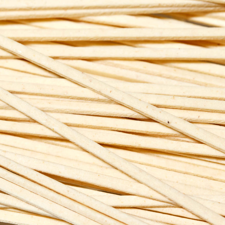 A close up of a pile of Hakubaku Organic Ramen Noodles sticks.