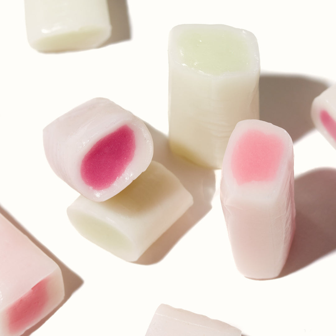 A group of Morinaga Hi-Chew: Assorted Mix cubes on a white surface.