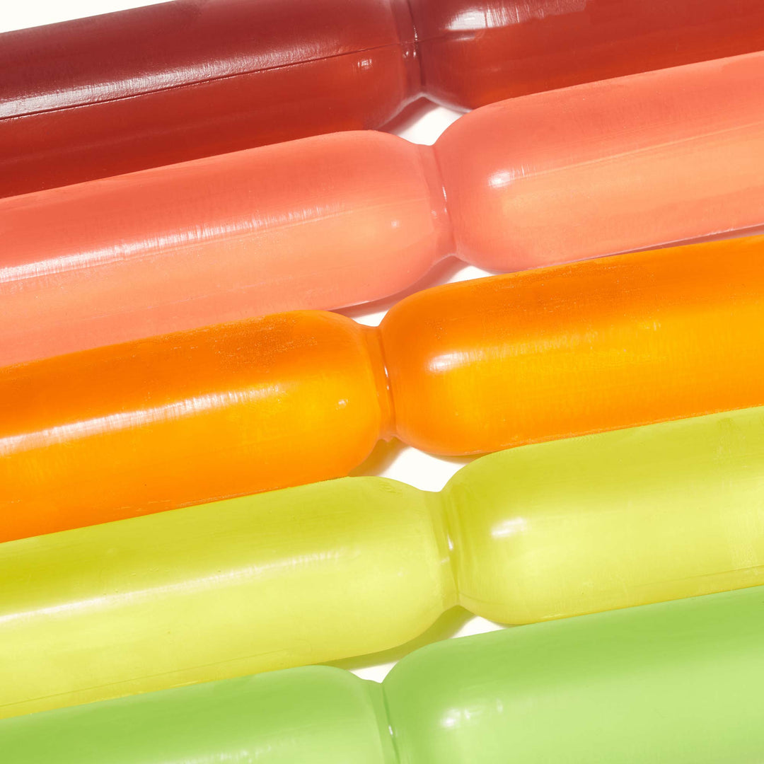 A group of Chucyfru Assorted Fruity Ice Popsicles on a white surface.