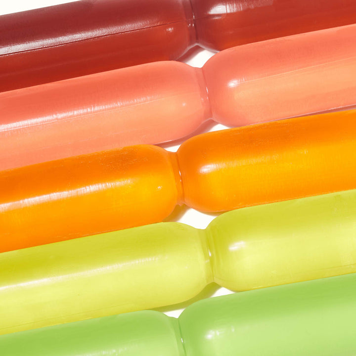 A group of Chucyfru Assorted Fruity Ice Popsicles on a white surface.