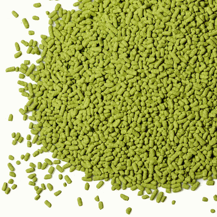A pile of Itoen Matcha Green Tea Powder: Sweet Matcha seeds on a white background.