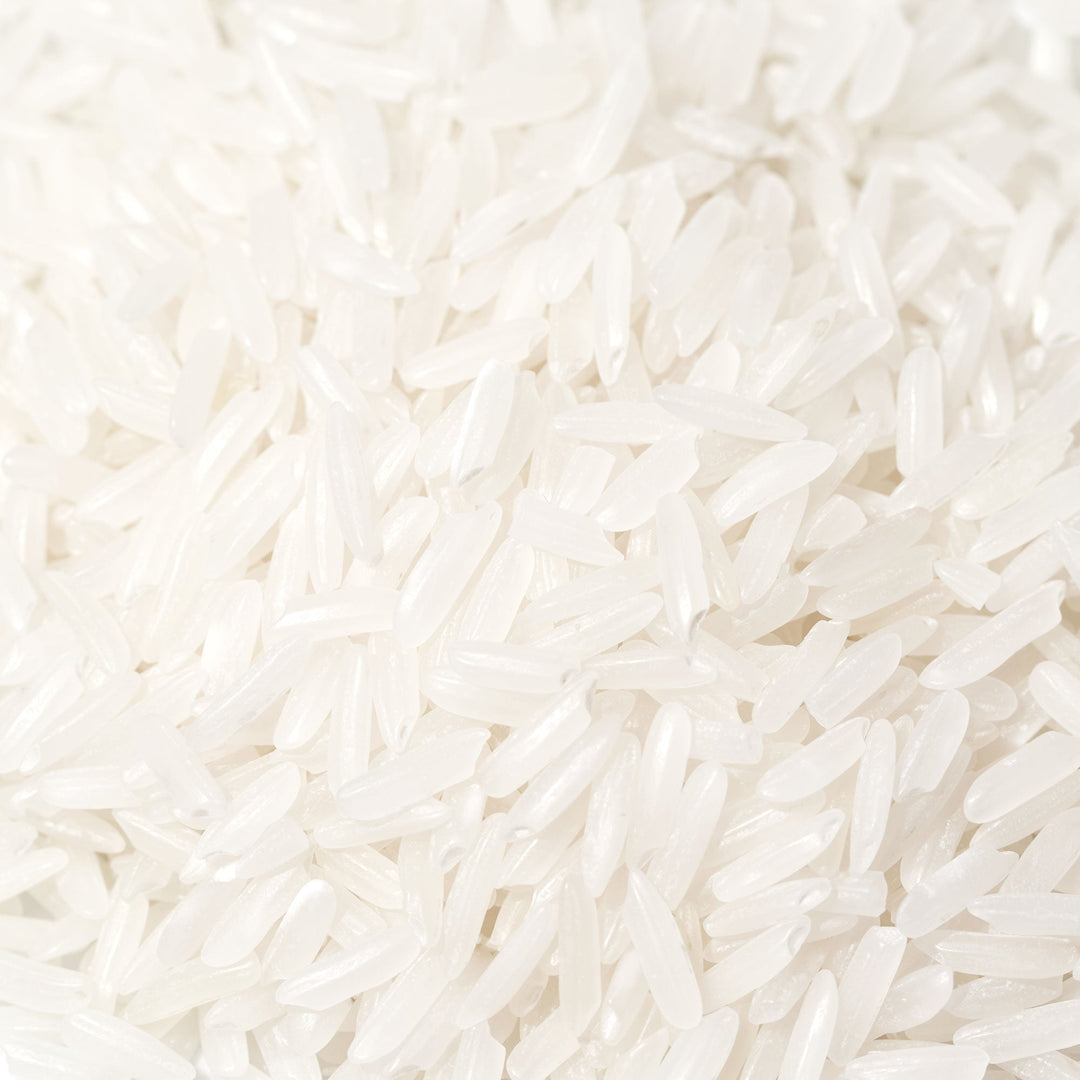 A pile of Fujii Niigata Iwafune Koshihikari Rice: 4.4 lb on a white background.