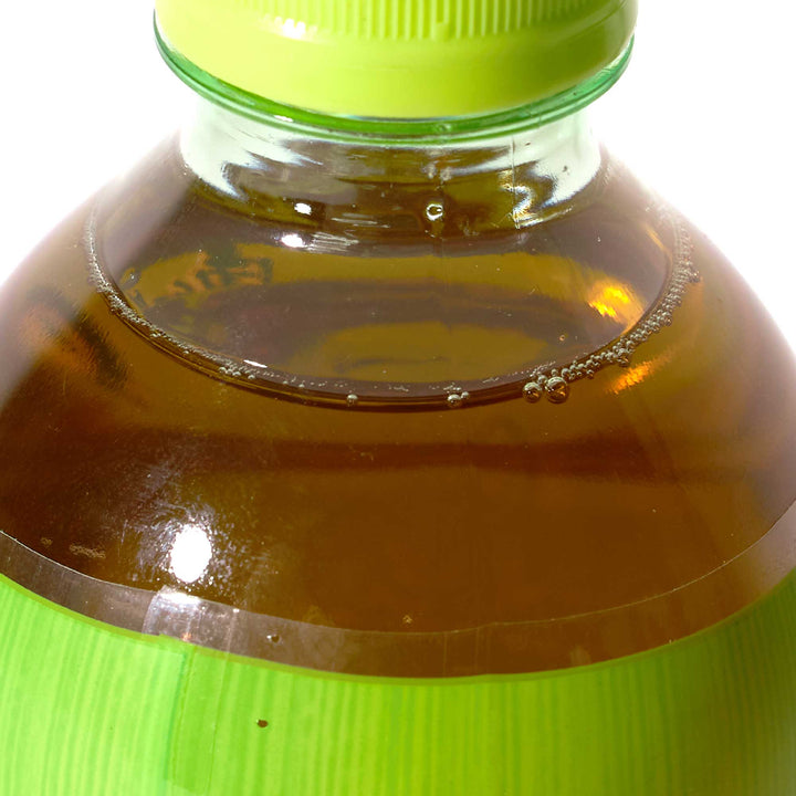 A Master Kong Iced Jasmine Green Tea bottle with a lid on it.